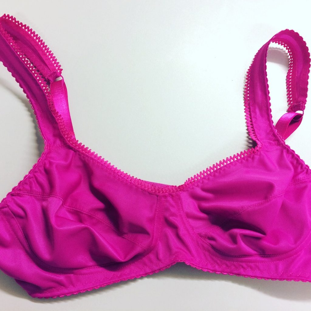 front of pink bra